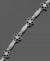 Give your style a boost with this cheerful flower bracelet featuring sparkling diamond accents. Victoria Townsend design crafted in sterling silver. Approximate length: 7 inches.