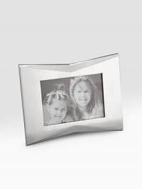 A classic frame in lustrous alloy metal is tweaked with a pinched detail and fits a vertical or horizontal photo. Accommodates a 5 X 7 photograph Wipe clean Imported 