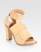 Slightly faded leather design with a wrap-around ankle strap, chunky heel and wide Velcro® straps. Self-covered heel, 4 (100mm)Covered platform, 1 (25mm)Compares to a 3 heel (75mm)Leather upperLeather lining and solePadded insoleMade in ItalyOUR FIT MODEL RECOMMENDS ordering true whole size; ½ sizes should order the next whole size down. 