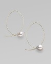 A delicate marquis shape, delineated in 14k gold wire, is capped by a lustrous pearl for a modern twist on a classic hoop. White freshwater baroque pearls 14k yellow gold Length, about 1¾ Width, about 1 Pierced Made in USA