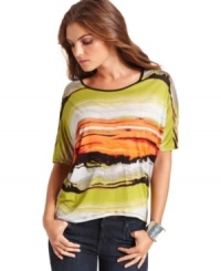With bright painterly stripes, this Kensie top is perfect for adding a pop of print to your cold-weather wardrobe! With bright painterly stripes, this Kensie top is perfect for adding a pop of print to your cold-weather wardrobe!