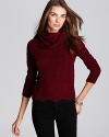 Cozy up to fall with Aqua's cowlneck sweater, sporting a scalloped hem and classic cable knit detail along the front.