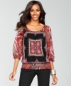 A scarf print and lush colors create an exotic look atop INC's petite peasant blouse.
