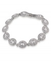 Inspire yourself in glamorous style. Carolee bracelet features oval-cut glass stones linked together in a silver tone mixed metal setting. Approximate length: 7 inches.