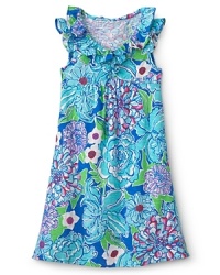 Sweet ruffles and a flowing floral drape beg to frolic all summer long. Sweet ruffles and a flowing floral drape beg to frolic all summer long.