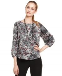 Nine West combines satin charmeuse with a bold take on classic animal print for a blouse that's chic enough for the weekend yet polished enough for the office. Nine West combines satin charmeuse with a bold take on classic animal print for a blouse that's chic enough for the weekend yet polished enough for the office.