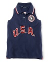 A red, white and blue design with U.S.A. patching and embroidered emblems gives a preppy, all-American look to the classic sleeveless polo, celebrating Team USA's participation in the 2012 Olympics.