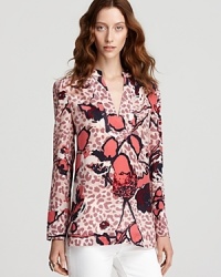 Blending prints big and small, this Tory Burch tunic boasts the perfect fashion mix. Showcase the standout style against sleek white denim. Blending prints big and small, this Tory Burch tunic boasts the perfect fashion mix. Showcase the standout style against sleek white denim.