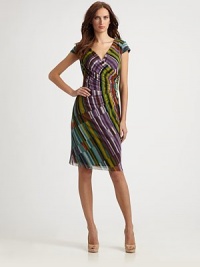 A colorful, kaleidoscopic print and intricate gathers elevate this soft mesh style.Surplice necklineCap sleevesAsymmetrical gathersFully linedConcealed back zipAbout 27 from natural waist95% polyester/5% spandexDry cleanImportedModel shown is 5'11 (180cm) wearing US size Small. A colorful, kaleidoscopic print and intricate gathers elevate this soft mesh style.Surplice necklineCap sleevesAsymmetrical gathersFully linedConcealed back zipAbout 27 from natural waist95% polyester/5% spandexDry cleanImportedModel shown is 5'11 (180cm) wearing US size Small.