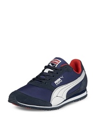An update on PUMA's heritage running shoe, the Steeple Jr. blends aggressive topstitching, tonal mesh panels and synthetic overlays for a lightweight shoe that looks as good as it feels. An update on PUMA's heritage running shoe, the Steeple Jr. blends aggressive topstitching, tonal mesh panels and synthetic overlays for a lightweight shoe that looks as good as it feels.