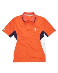 Bold color-blocking accents an athletic polo shirt, crafted from ultra-breathable mesh microfiber with perforated side panels for additional comfort. Bold color-blocking accents an athletic polo shirt, crafted from ultra-breathable mesh microfiber with perforated side panels for additional comfort.