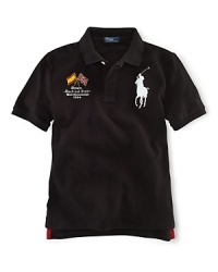 A preppy short-sleeved polo shirt in breathable cotton mesh is accented with country embroidery. A preppy short-sleeved polo shirt in breathable cotton mesh is accented with country embroidery.