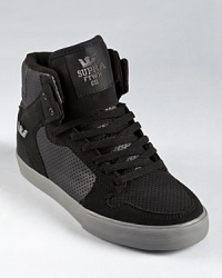 Classic high top design perched atop a authentic vulcanized sole, with perforation on the sides and a padded collar providing superior ankle support and comfort. Classic high top design perched atop a authentic vulcanized sole, with perforation on the sides and a padded collar providing superior ankle support and comfort.