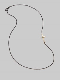 A gleaming 14K gold cross on an oxidized silver chain.14K gold Oxidized sterling silver Length, about 16 Pendant length, about ¾ Lobster clasp closure Made in USA A gleaming 14K gold cross on an oxidized silver chain.14K gold Oxidized sterling silver Length, about 16 Pendant length, about ¾ Lobster clasp closure Made in USA