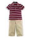This adorable set pairs a breathable jersey-knit striped polo with a traditional chino pant and a bulldog ribbon belt for preppy, tailored style.