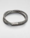 A double strand of fine Italian leather in a unique stingray pattern is offset by a sterling silver cylindrical clasp.LeatherSterling silverAbout 2½ diam.Made in the United Kingdom