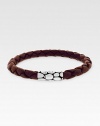 A sterling silver button clasp offers contrasting color and texture to finely braided leather. Length, about 8 Imported