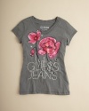 GUESS embellishes this v neck tee with a pretty rose print rendered with sequin accents and an embroidered GUESS JEANS on the front.