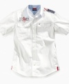 Old glory. He'll stand out in this shirt from Tommy Hilfiger, with American flag graphic to complement his sharp look.