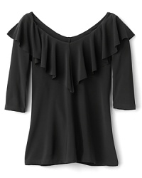 An everyday tee by Aqua gets a lofty update with a graceful v-neck tee and a flouncy ruffle trim. An everyday tee by Aqua gets a lofty update with a graceful v-neck tee and a flouncy ruffle trim.