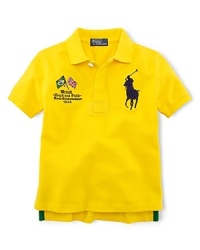 A preppy short-sleeved polo shirt in breathable cotton mesh is accented with country embroidery, celebrating Team USA's participation in the 2012 Olympics. A preppy short-sleeved polo shirt in breathable cotton mesh is accented with country embroidery, celebrating Team USA's participation in the 2012 Olympics.