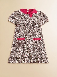 Here's the spot for a wild and fun animal print in a soft, sweater-y knit with bright contrast trim.Contrast ribbed crew neckline with bowShort sleeves with elasticized cuffsKeyhole button back closeFront patch pockets with contrast bow trimA-line shapeRuffled hemRamie/cottonMachine washImported Here's the spot for a wild and fun animal print in a soft, sweater-y knit with bright contrast trim.Contrast ribbed crew neckline with bowShort sleeves with elasticized cuffsKeyhole button back closeFront patch pockets with contrast bow trimA-line shapeRuffled hemRamie/cottonMachine washImported