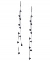 Fire up your evening with these two-row linear earrings from GUESS. Black diamond-embellished fireballs hang from metal chains. Crafted in hematite tone mixed metal. Approximate drop: 7 inches.