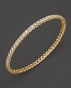 Simply chic--single or stacked. Faceted diamonds set in gleaming 18K yellow gold. By Roberto Coin.