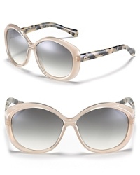 Sleek round frames meet contrast tortoise arms for an edgy silhouette from Balenciaga. Sleek round frames meet contrast tortoise arms for an edgy silhouette from Balenciaga.