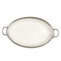 This revolutionary collection combines white ceramic with hand-finished pewter trim, creating a stunning marriage of light and shadow. The entire collection is dishwasher safe. This revolutionary collection combines white ceramic with hand-finished pewter trim, creating a stunning marriage of light and shadow. The entire collection is dishwasher safe.