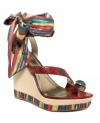 Indulge in the boldness of Brasil in FALCHI by Falchi's Cruz platform wedge sandals. A brightly-patterned fabric ankle strap adds edge while the bejeweled toe ring keeps things super sexy.