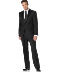 Elegantly simple, this sophisticated two-button tuxedo is a classic choice for black-tie affairs. Traditionally tailored, the jacket features satin-covered buttons, a notched satin lapel, chest welt pocket and front flap pockets with satin besoms. No back vent. Double reverse-pleated pant has on-seam pockets, suspender buttons instead of belt loops and satin braids on the side seam. Back besom pockets. Elegantly simple, this sophisticated two-button tuxedo is a classic choice for black-tie affairs. Traditionally tailored, the jacket features satin-covered buttons, a notched satin lapel, chest welt pocket and front flap pockets with satin besoms. No back vent. Double reverse-pleated pant has on-seam pockets, suspender buttons instead of belt loops and satin braids on the side seam. Back besom pockets.