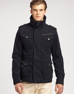 This classic outerwear silhouette exudes a mixed-media effect, structured in rich cotton with nylon accents on the collar, shoulder and elbows, finished with a logo patch near the rear hem.Zip frontStand collarChest, hip flap pocketsShoulder epaulettesAbout 29 from shoulder to hemCottonDry cleanImported