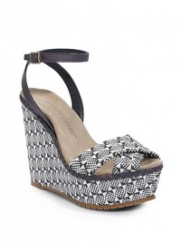 THE LOOKCrisscross two-tone woven raffia upperAdjustable leather ankle strapBraided leather trim around the outsoleWoven raffia-covered wedge, 5 (125mm)Hemp-covered platform, 1½ (40mm)Compares to a 3½ heel (90mm)THE MATERIALWoven raffia upper and liningSuede footbedRubber soleORIGINMade in Spain THE LOOKCrisscross two-tone woven raffia upperAdjustable leather ankle strapBraided leather trim around the outsoleWoven raffia-covered wedge, 5 (125mm)Hemp-covered platform, 1½ (40mm)Compares to a 3½ heel (90mm)THE MATERIALWoven raffia upper and liningSuede footbedRubber soleORIGINMade in Spain