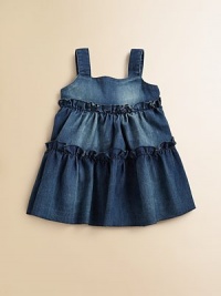 A pretty, prairie look in tiers of soft denim with tiny ruffles and bright print scarf ties in back.Wide strapsSquared necklineSmooth bodiceEmpire waist with rufflesShirred, ruffled tiered skirtGathered back with fruit print scarf tiesPullover styling61% cotton/29% polyester/6% silk/4% spandexDry cleanImported A pretty, prairie look in tiers of soft denim with tiny ruffles and bright print scarf ties in back.Wide strapsSquared necklineSmooth bodiceEmpire waist with rufflesShirred, ruffled tiered skirtGathered back with fruit print scarf tiesPullover styling61% cotton/29% polyester/6% silk/4% spandexDry cleanImported