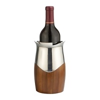 Whether Chardonnay, Zinfandel or Riesling, every white wine deserves a good chill. Our Cradle Wine Chiller is expertly designed to keep wine at the exact right temperature –even when you linger at the table for hours. It hugs your bottle in an aristocratic blend of wood and metal alloy, with an attractive curved lip to punctuate the look. Treat yourself and do away with mid-meal runs to the fridge– or give it as a gift to a harried host or hostess. Whether Chardonnay, Zinfandel or Riesling, every white wine deserves a good chill. Our Cradle Wine Chiller is expertly designed to keep wine at the exact right temperature –even when you linger at the table for hours. It hugs your bottle in an aristocratic blend of wood and metal alloy, with an attractive curved lip to punctuate the look. Treat yourself and do away with mid-meal runs to the fridge– or give it as a gift to a harried host or hostess.
