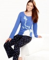 Stay warm in these pajamas by HUE featuring a polar bear on the top and polka dots on the fleece pants.