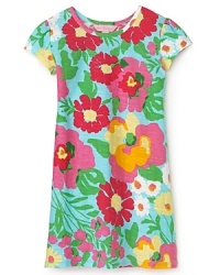 Overlapping flowers in oversaturated hues evoke a retro sensibility in Lilly Pulitzer's Little Kelsea dress. Overlapping flowers in oversaturated hues evoke a retro sensibility in Lilly Pulitzer's Little Kelsea dress.