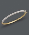 With a flip of the wrist, add some sparkling, and stackable, style! Victoria Townsend's trendy bangle can be layered with other bangles, or worn alone for a subtle statement. Crafted in 18k gold over sterling silver and covered with round-cut diamonds (1/4 ct. t.w.). Approximate diameter: 2-1/2 inches.