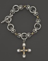 An etched sterling silver and 18K yellow gold link bracelet embellished with a pearl-accented cross. By Konstantino.