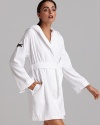 Plush, absorbent, and colorful women's robe with a hood and large bouclé croc on the shoulder.