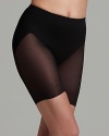 TC Fine Intimates' bike shorts are rendered in an airy, sheer fabric and boast a reinforced front panel for tummy control and pronounced rear shaping. Style #4319