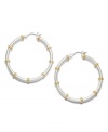 Traditional hoops with a fabulous two tone touch! From the Lauren by Ralph Lauren collection, medium-sized hoop earrings feature a silver tone mixed metal base with gold tone mixed metal accents and click closure. Approximate diameter: 1-1/4 inches.