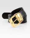 Polished, gold-plated buckle, with logo detail, adorns this reversible leather design.LeatherAbout 1¼ wideMade in Italy