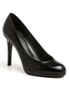 These stylish Stuart Weitzman pumps will take you places, with elegant almond toes and user-friendly platform heels.