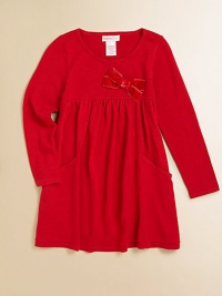 A cozy, cute knit frock with a velveteen bow and front pockets for utility and style.Round necklineLong sleevesPullover styleHigh-waisted with velveteen bowPatch pockets95% viscose/5% spandexHand washImported A cozy, cute knit frock with a velveteen bow and front pockets for utility and style.Round necklineLong sleevesPullover styleHigh-waisted with velveteen bowPatch pockets95% viscose/5% spandexHand washImported