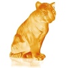 The sitting tiger in amber crystal, a color reminding of fire, glimmers with changing reflections, from amber to cognac, making each piece unique. Described as brave, impulsive and solitary, the sitting tiger, both proud and haughty, has the power and grace of the great felines. Imposing and majestic, this crystal feline of satin finished amber crystal is a symbol of power and virility.