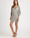 Delicate cut-outs and hand-beaded sequins define this effortless viscose shift.BoatneckDropped shouldersDolman sleevesAbout 31 from shoulder to hemViscoseDry cleanImportedModel shown is 5'10 (177cm) wearing US size Small.