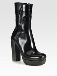 A sky-high stacked heel feminizes this urban-ready silhouette in fine Italian leather. Stacked heel, 4¾ (120mm)Stacked platform, ¾ (20mm)Compares to a 4 heel (100mm)Shaft, 8Leg circumference, 10Leather upperSide zipLeather lining and solePadded insoleMade in Italy A sky-high stacked heel feminizes this urban-ready silhouette in fine Italian leather. Stacked heel, 4¾ (120mm)Stacked platform, ¾ (20mm)Compares to a 4 heel (100mm)Shaft, 8Leg circumference, 10Leather upperSide zipLeather lining and solePadded insoleMade in Italy