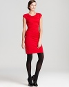 Allover ruching lends effortless figure flattery to a curve-conscious DKNYC dress for an endlessly chic style choice.